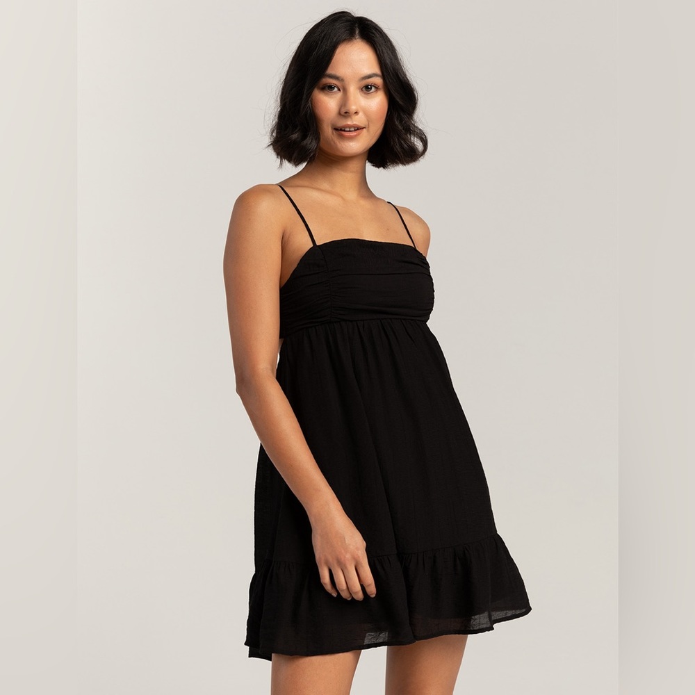 Black mini sundress with ruffle and back tie